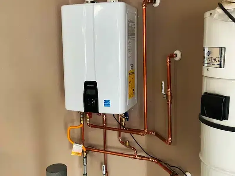 Technician repairing a leaking tankless water heater in Riverside, CA 92504